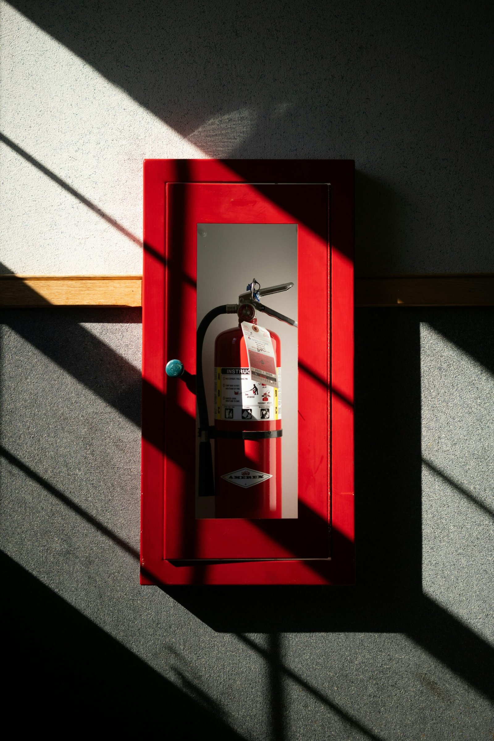 A fire extinguisher hanging on a wall